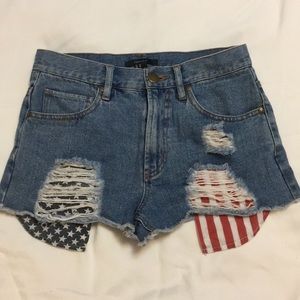 High waisted distressed denim jean shorts.